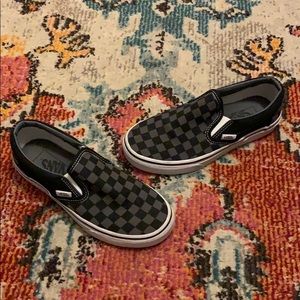 Black and grey checkerboard Vans Slip Ons